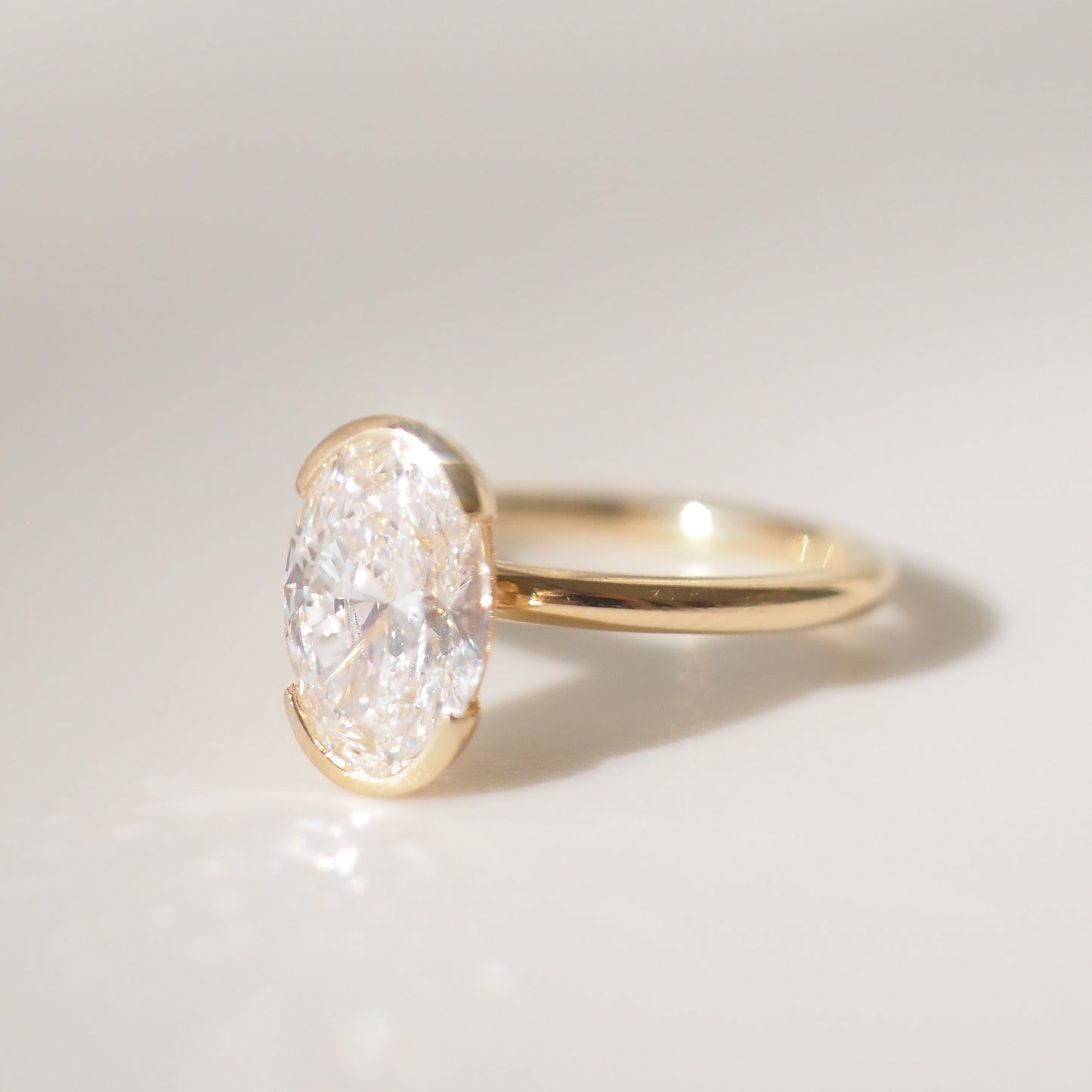 Oval Shaped Half Bezel Lab Grown Diamond Engagement Ring